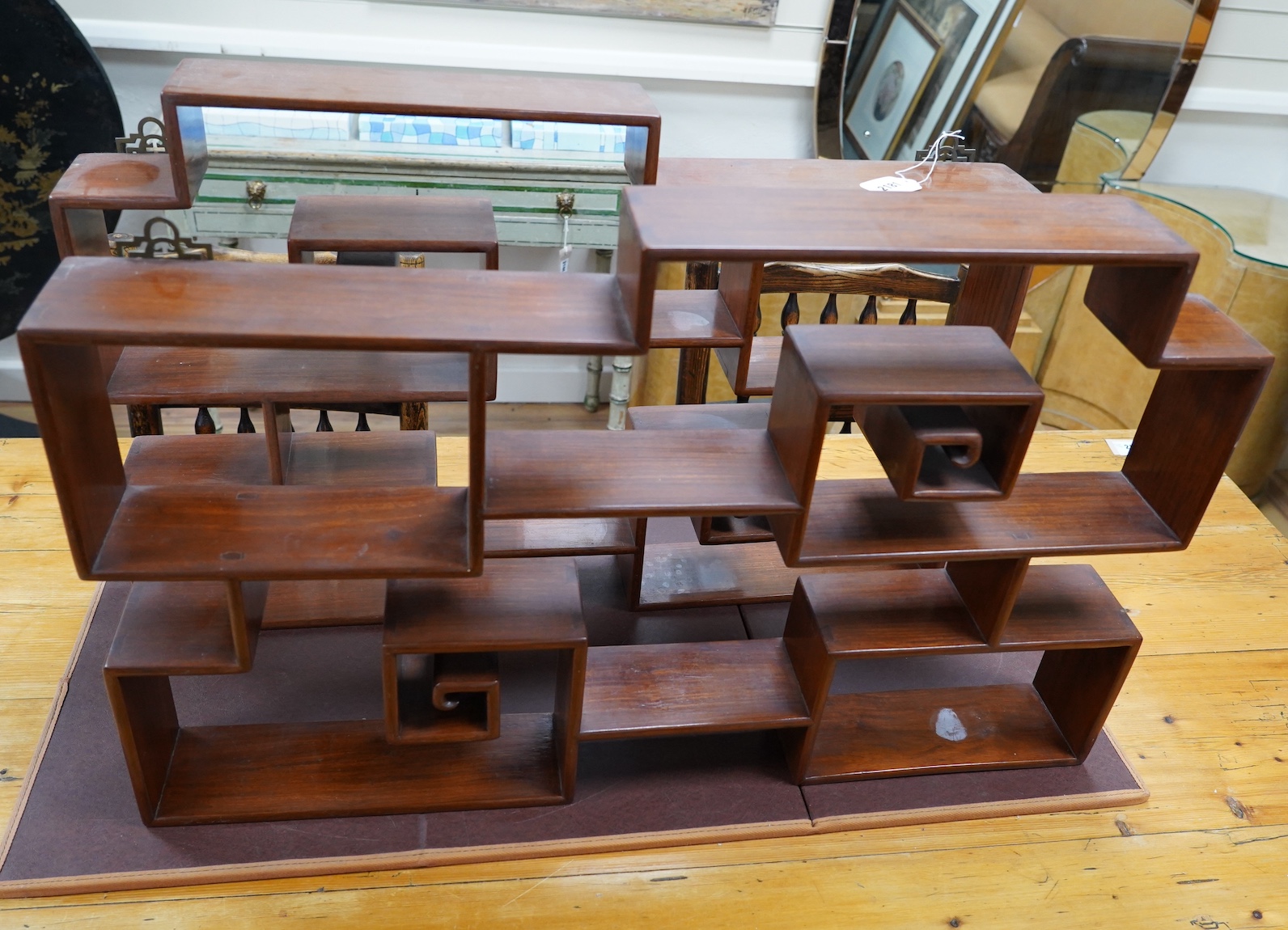 A pair of Chinese padouk wood display shelves, width 80cm, depth 10cm, height 51cm. Condition - fair